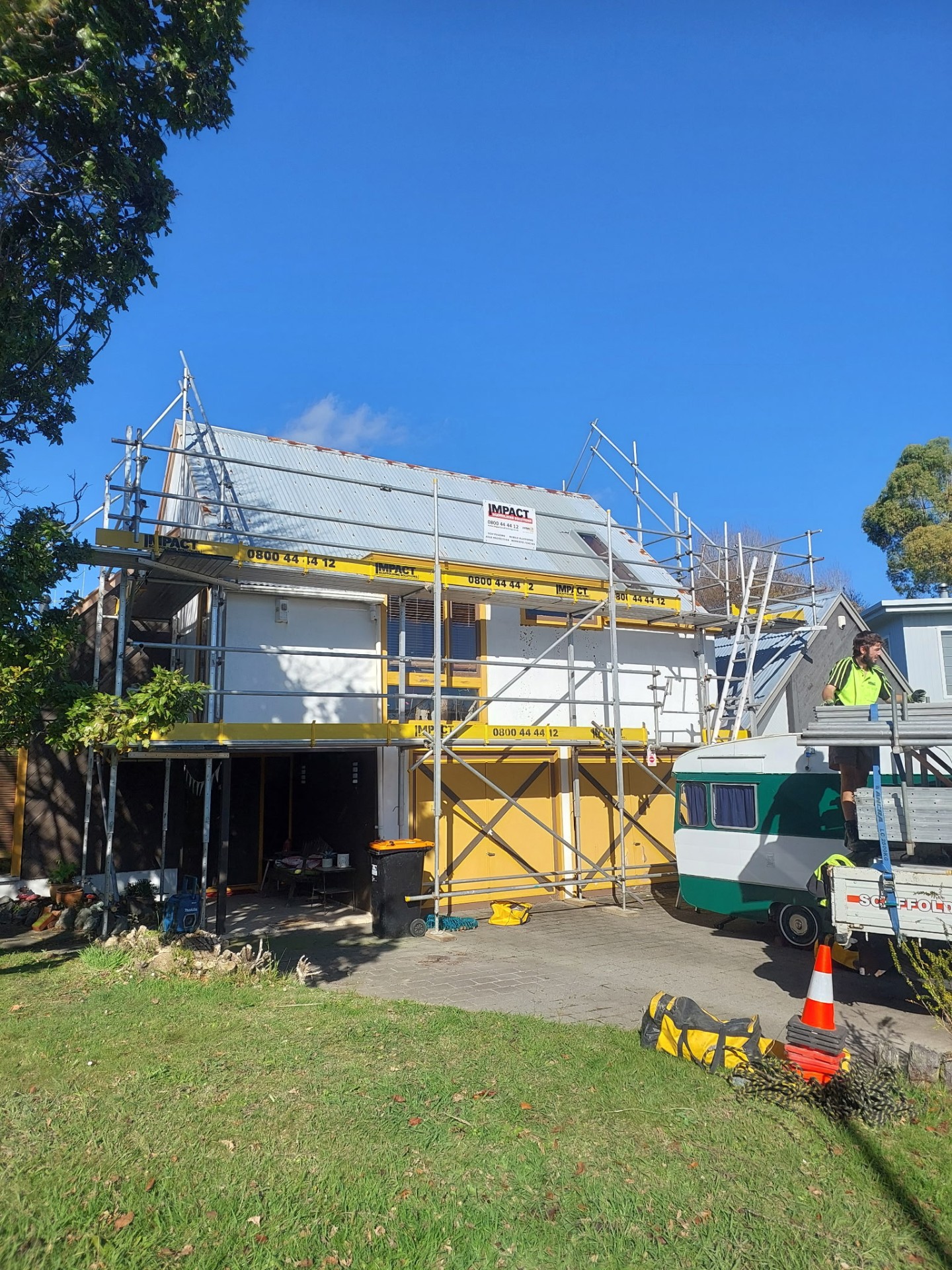 Impact Scaffolding crew working on a two-storey residential scaffold